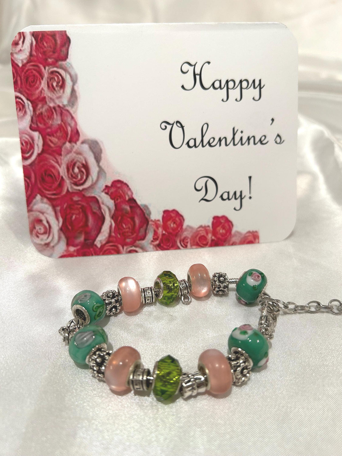 Green, pink and gold-beaded bracelet.