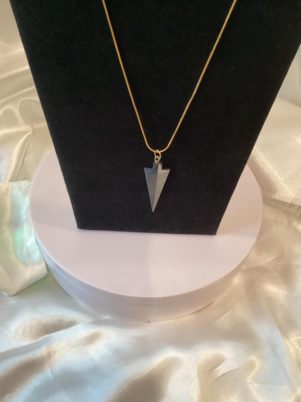 Gold-toned Necklace with Striking Dark-Grey Arrowhead Pendant