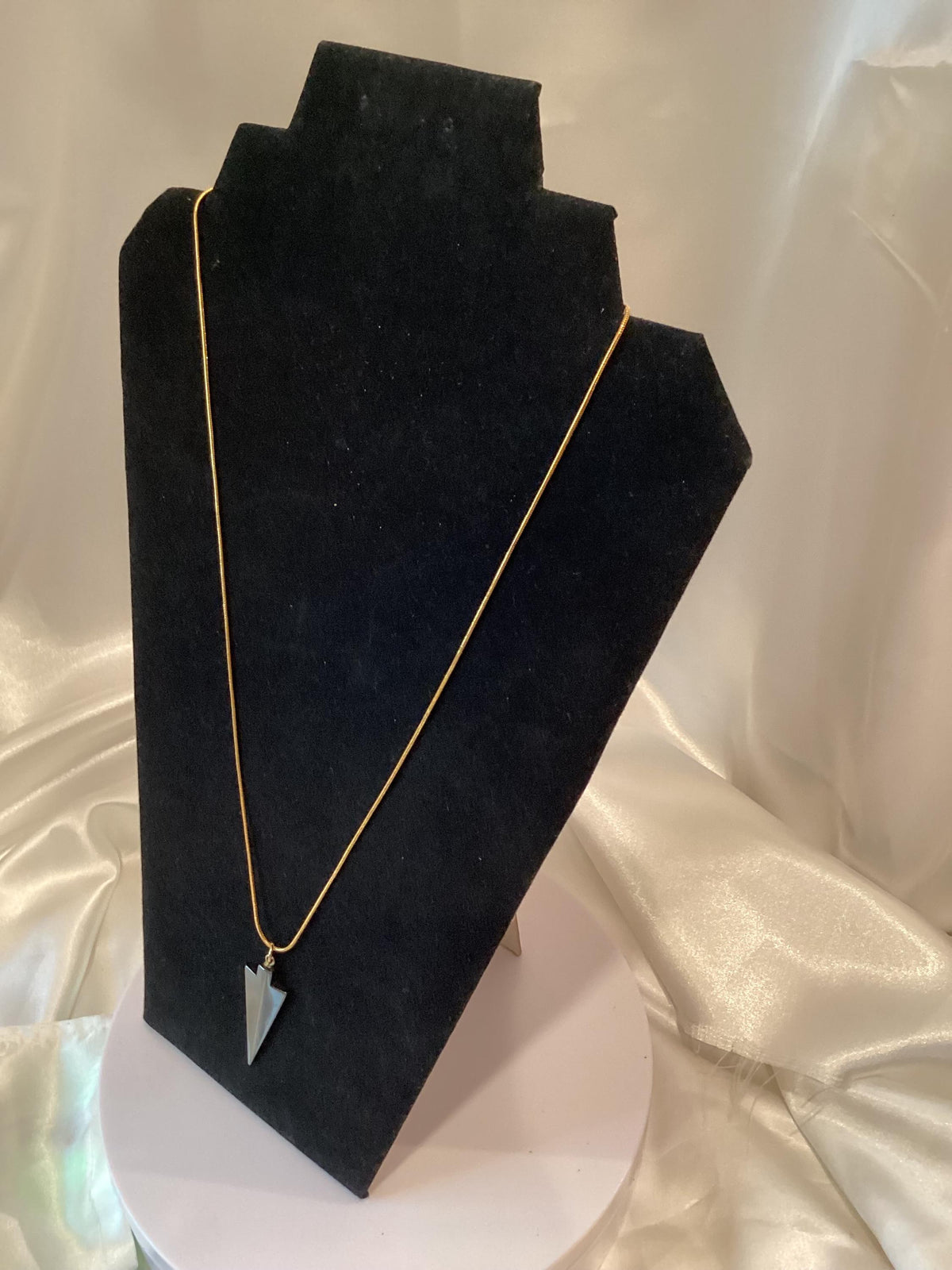 Gold-toned Necklace with Striking Dark-Grey Arrowhead Pendant